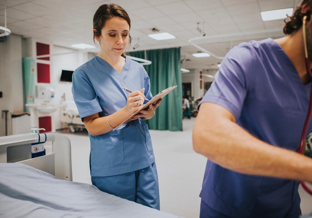 nurse writing notes in hospital-min-1-1